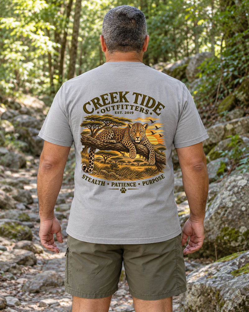 Lifestyle mockup with original artwork: Creek Tide® Stealth-Patience-Purpose — Leopard in Grey, back view