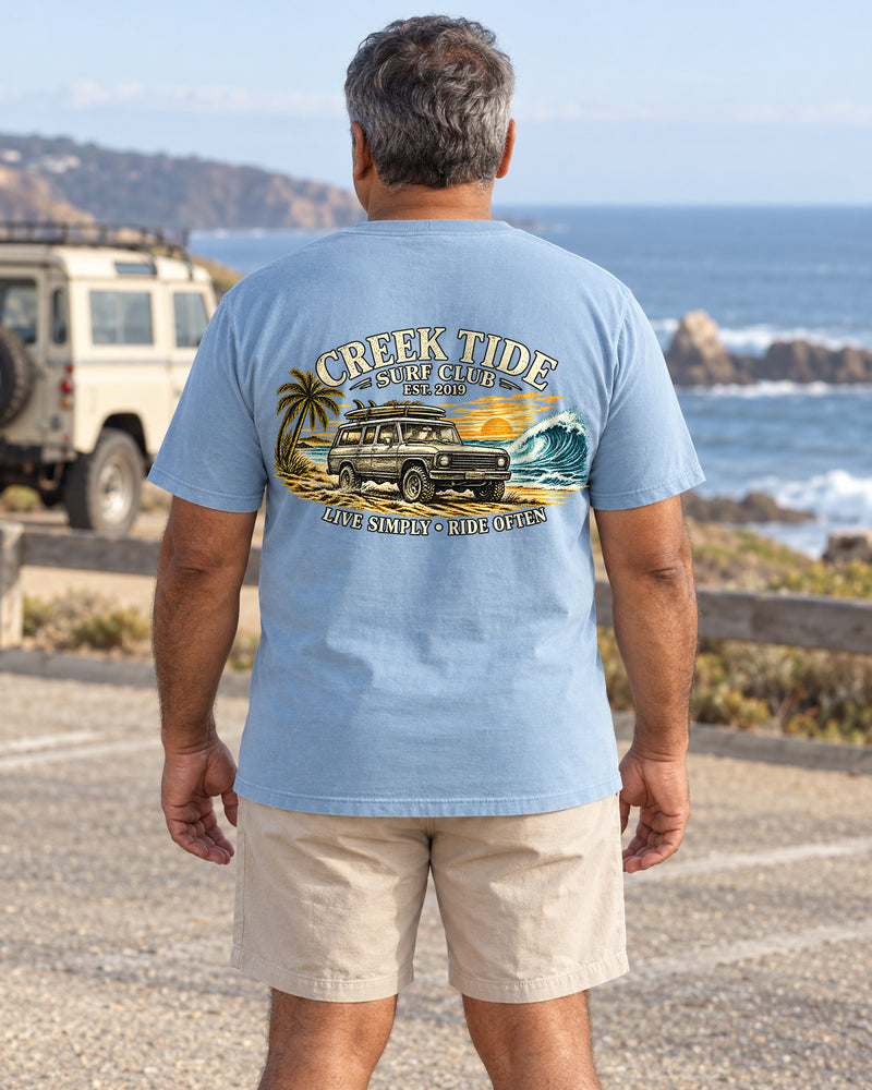 Lifestyle mockup with original artwork: Creek Tide® Live Simply-Ride Often in Chambray, back view