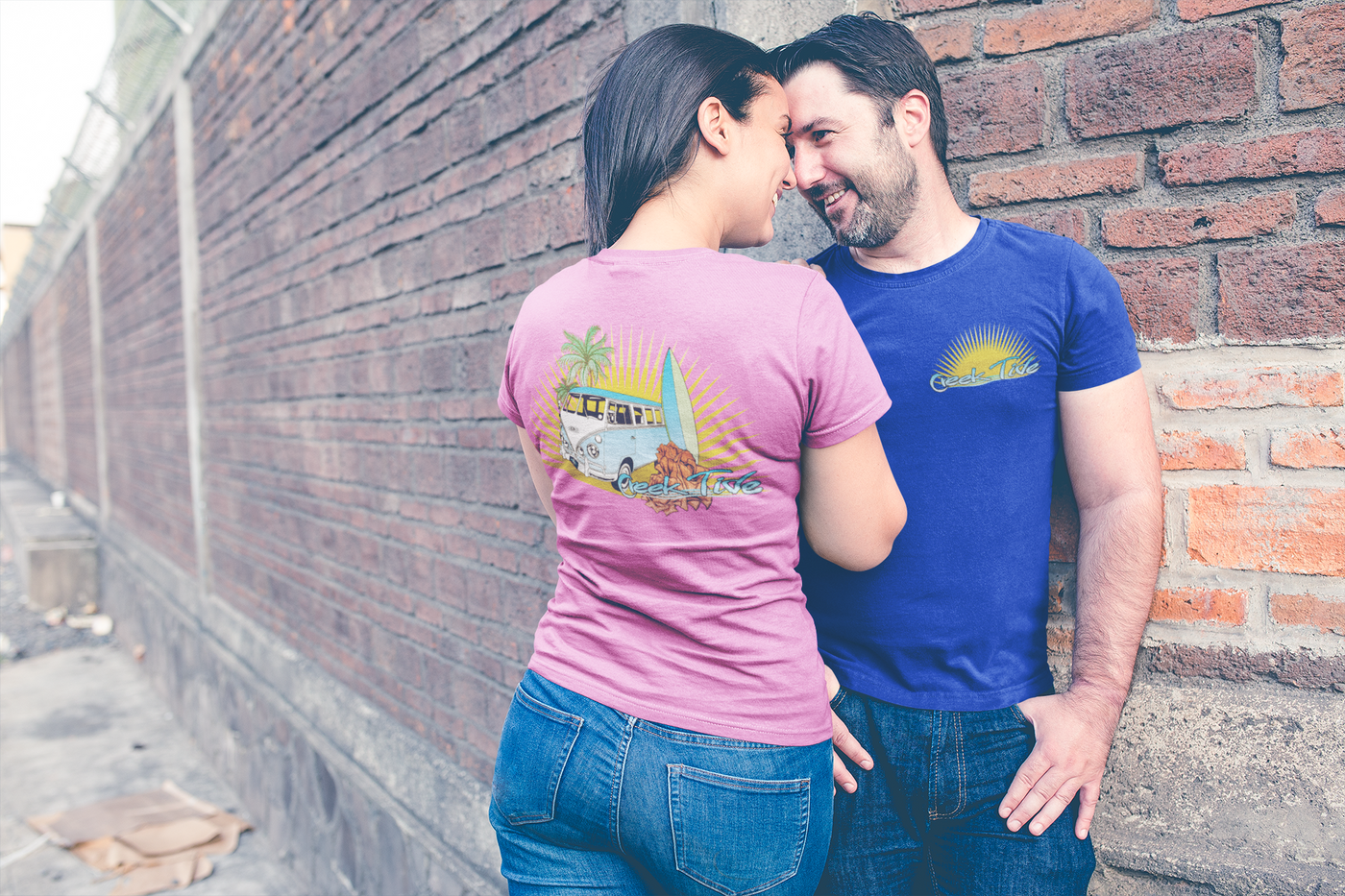 loving couple wearing t shirts mockup showing their back and front designs in the street